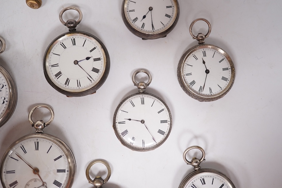Three early to mid 20th century silver open faced pocket watches, with Roman or Arabic dials and subsidiary seconds, including two keyless and one key wind (Admiral Tacy Watch Co), together with one smaller silver open f